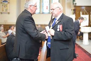 Senator Speaks To Bishop -photo